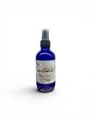 Blue spray bottle with a label on a white background