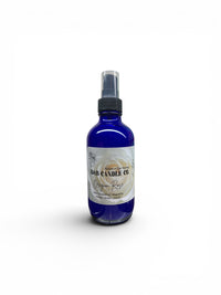 Blue spray bottle with a label on a white background