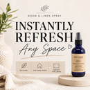 Room and linen spray bottle with packaging on a neutral background